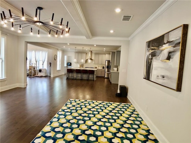 interior space with baseboards, ornamental molding, recessed lighting, visible vents, and dark wood finished floors