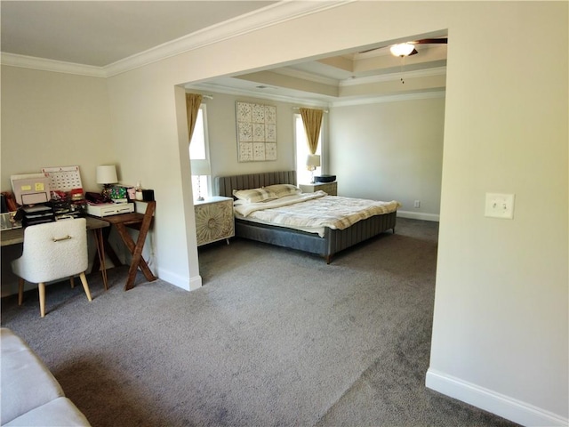 carpeted bedroom featuring a tray ceiling, crown molding, and baseboards