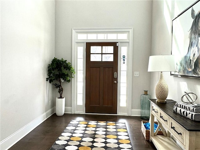 entryway with baseboards and dark wood finished floors