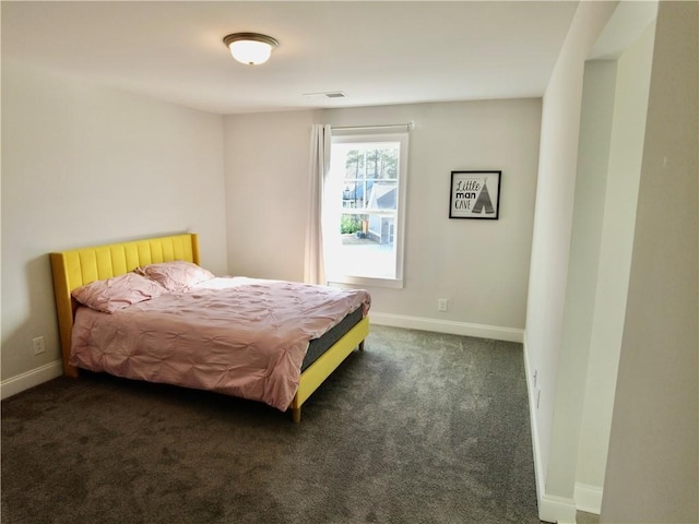bedroom featuring carpet flooring, baseboards, and visible vents