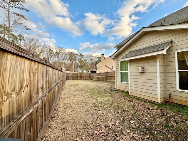 view of yard with a fenced backyard