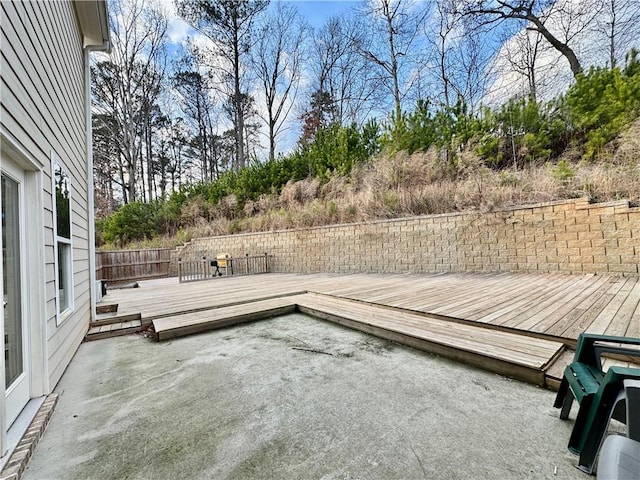 exterior space with fence and a deck