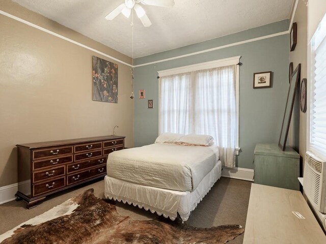 bedroom with carpet, multiple windows, and ceiling fan