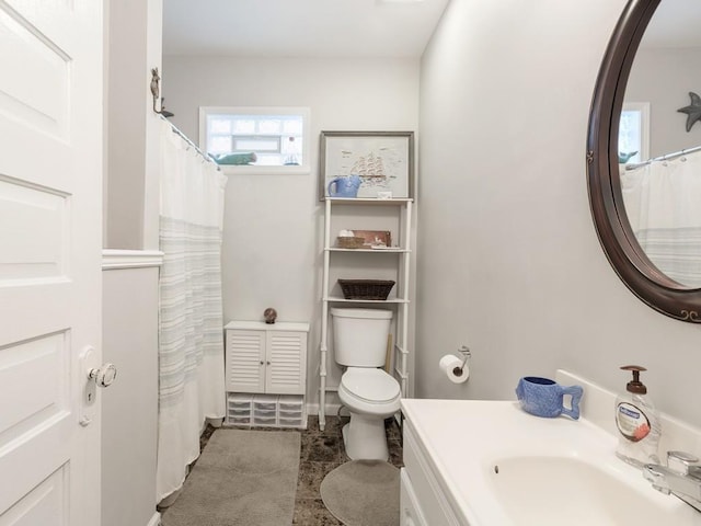 bathroom featuring vanity and toilet