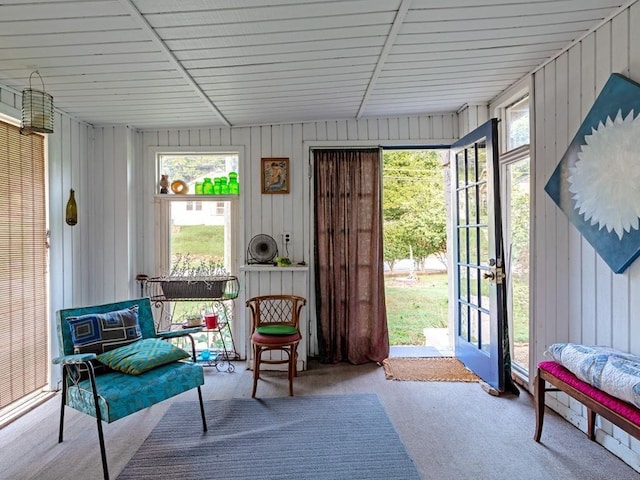 sunroom with vaulted ceiling and wooden ceiling