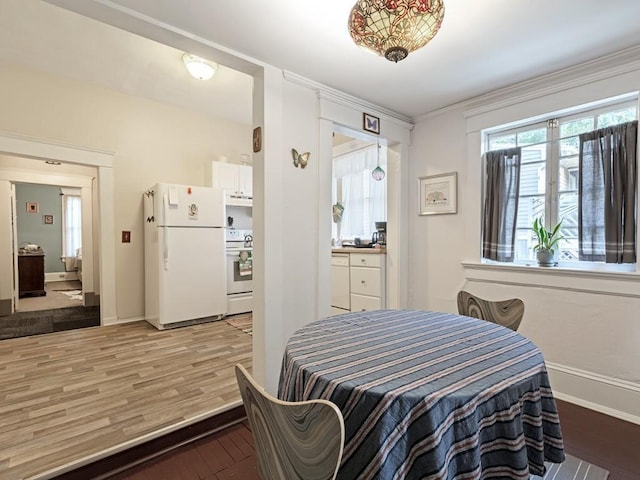 dining area with wood-type flooring