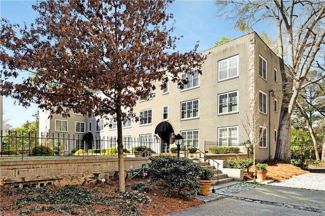 view of building exterior featuring fence