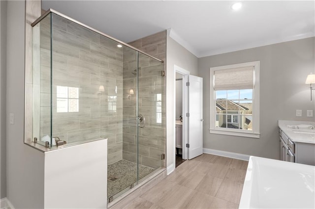 bathroom with an enclosed shower and vanity