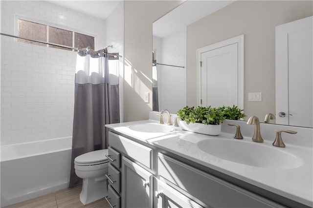 full bathroom featuring vanity, toilet, and shower / bathtub combination with curtain