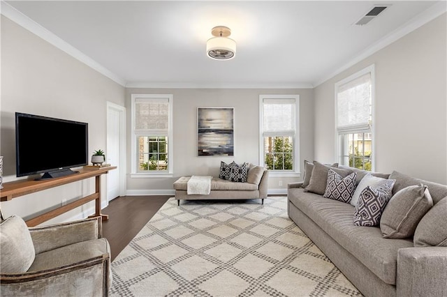 living room featuring hardwood / wood-style flooring and ornamental molding