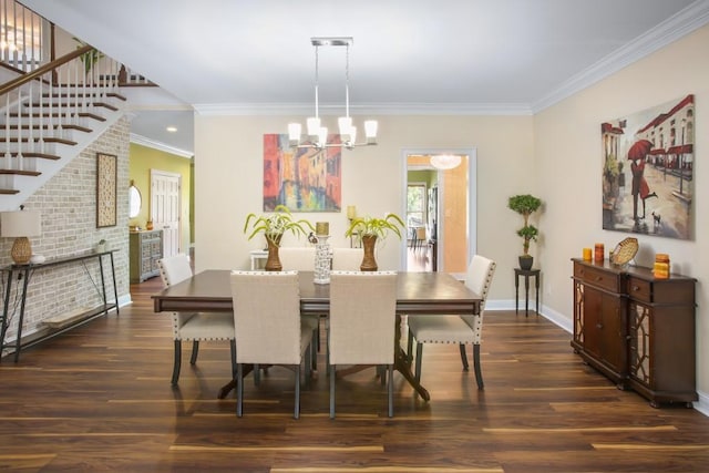 dining area featuring ornamental molding, dark wood-type flooring, and an inviting chandelier