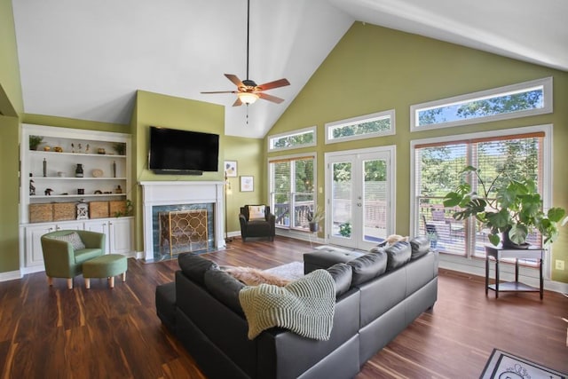 living room featuring french doors, ceiling fan, hardwood / wood-style flooring, high vaulted ceiling, and built in features