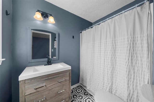 9430 Chestatee Ct, Gainesville, GA 30506 - full bath featuring vanity, a textured ceiling, and a shower with shower curtain