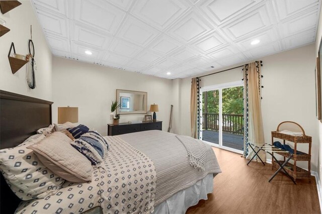 9430 Chestatee Ct, Gainesville, GA 30506 - bedroom featuring access to outside, recessed lighting, wood finished floors, and an ornate ceiling