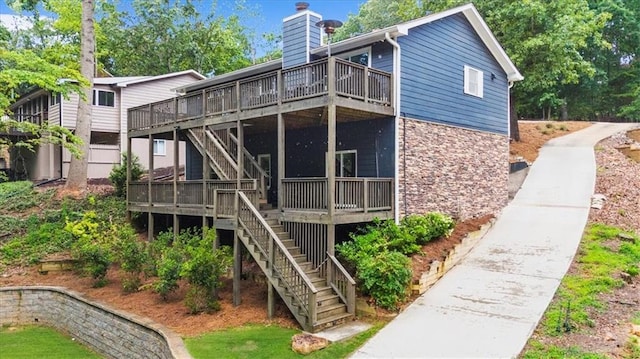 9430 Chestatee Ct, Gainesville, GA 30506 - rear view of house with stairway, stone siding, a wooden deck, and a chimney