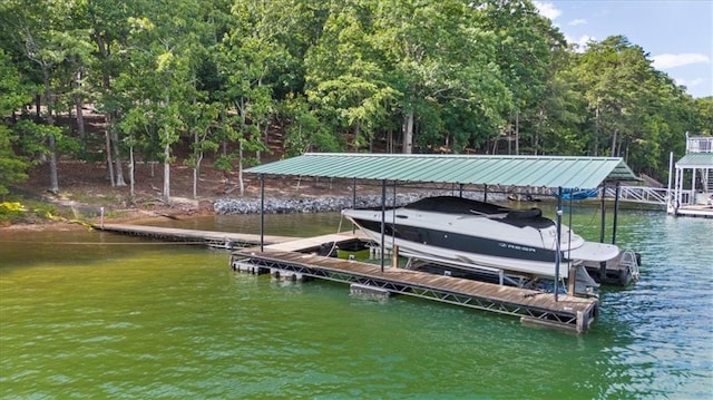 9430 Chestatee Ct, Gainesville, GA 30506 - dock area with boat lift, a water view, and view of scattered trees