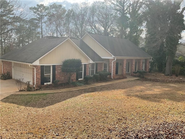 view of front of property with a garage and a front lawn