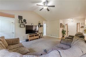 carpeted living room with vaulted ceiling and ceiling fan