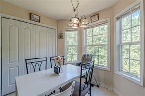 dining area with an inviting chandelier and a healthy amount of sunlight