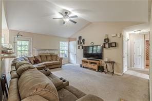 carpeted living room with lofted ceiling and ceiling fan