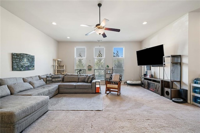 living room featuring carpet flooring, a ceiling fan, and recessed lighting