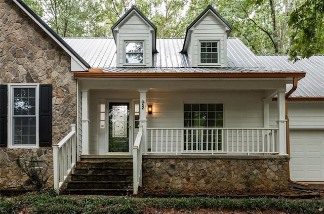 view of front facade with a garage and a porch