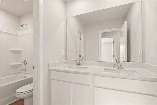 4032 Trimrose Ct, Atlanta, GA 30349 - bathroom with double vanity, toilet, and bathing tub / shower combination