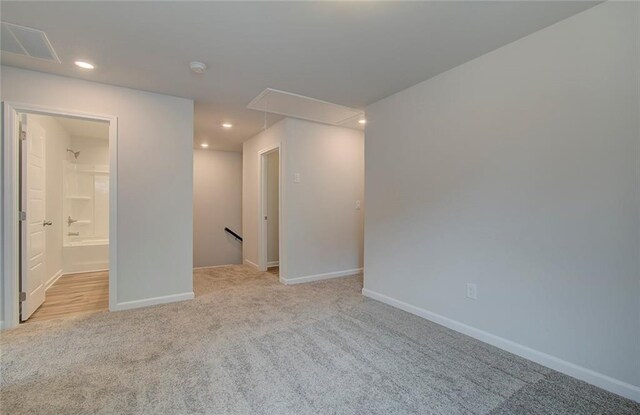 unfurnished room featuring ceiling fan, light hardwood / wood-style floors, and a healthy amount of sunlight