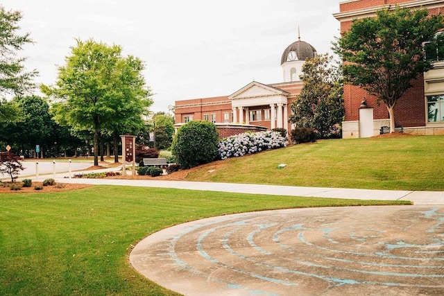 surrounding community featuring a lawn