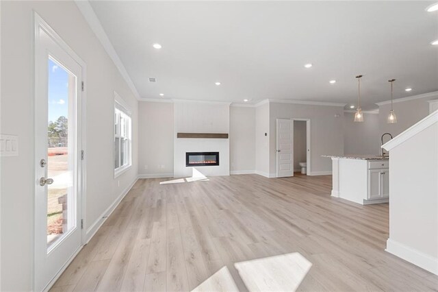 kitchen featuring a kitchen island with sink, dark brown cabinets, stainless steel appliances, and dark hardwood / wood-style floors