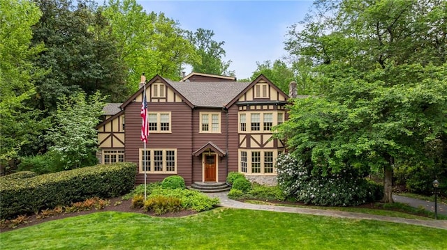 44 Muscogee Ave NW, Atlanta, GA 30305 - tudor house featuring a chimney and a front yard