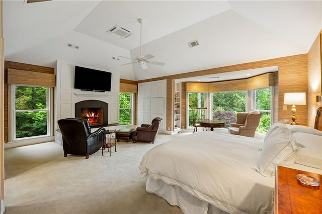44 Muscogee Ave NW, Atlanta, GA 30305 - bedroom featuring a lit fireplace, multiple windows, carpet, high vaulted ceiling, and ceiling fan
