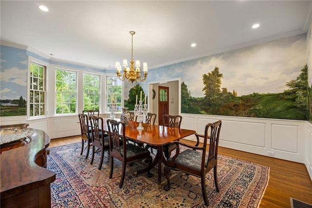 44 Muscogee Ave NW, Atlanta, GA 30305 - dining area with a decorative wall, a chandelier, crown molding, wood finished floors, and wainscoting