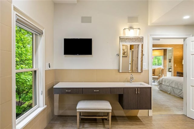 44 Muscogee Ave NW, Atlanta, GA 30305 - bathroom featuring connected bathroom, vanity, and wood finished floors