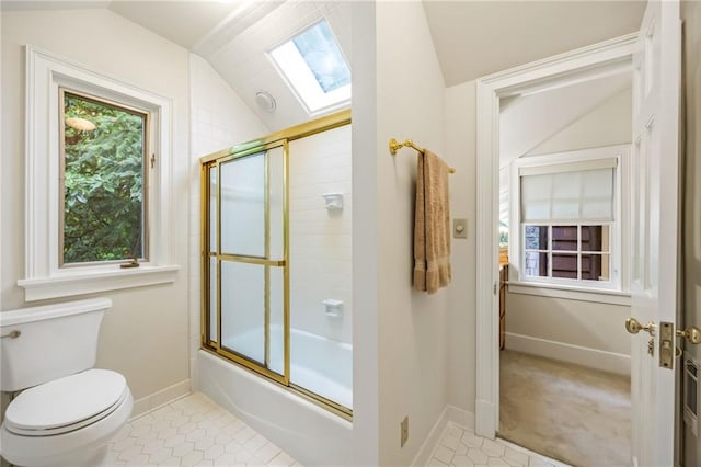 44 Muscogee Ave NW, Atlanta, GA 30305 - full bath featuring lofted ceiling, a skylight, enclosed tub / shower combo, toilet, and tile patterned flooring