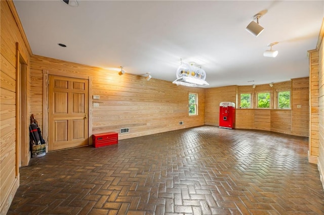 44 Muscogee Ave NW, Atlanta, GA 30305 - spare room featuring wood walls and brick flooring