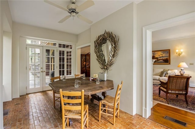 44 Muscogee Ave NW, Atlanta, GA 30305 - dining area with brick flooring, french doors, healthy amount of natural light, and ceiling fan