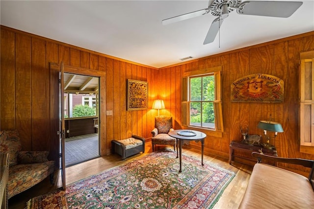 44 Muscogee Ave NW, Atlanta, GA 30305 - living area featuring wood walls, wood finished floors, and a ceiling fan