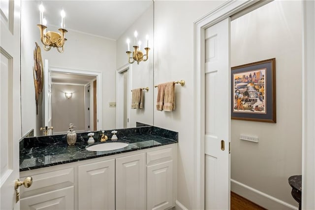 44 Muscogee Ave NW, Atlanta, GA 30305 - bathroom featuring vanity, ornamental molding, baseboards, and wood finished floors