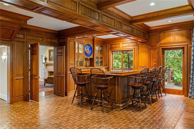44 Muscogee Ave NW, Atlanta, GA 30305 - indoor wet bar featuring wood walls, brick floors, beam ceiling, a fireplace, and ornamental molding