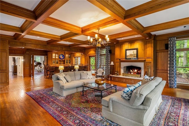 44 Muscogee Ave NW, Atlanta, GA 30305 - living area featuring a chandelier, wooden walls, beamed ceiling, coffered ceiling, and a warm lit fireplace