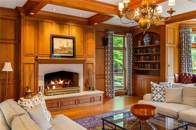 44 Muscogee Ave NW, Atlanta, GA 30305 - living area featuring a chandelier, wood finished floors, coffered ceiling, beamed ceiling, and a warm lit fireplace