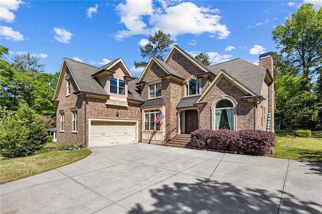 1614 Rucker Rd, Alpharetta, GA 30009 - craftsman-style house with concrete driveway, a garage, a front yard, and brick siding