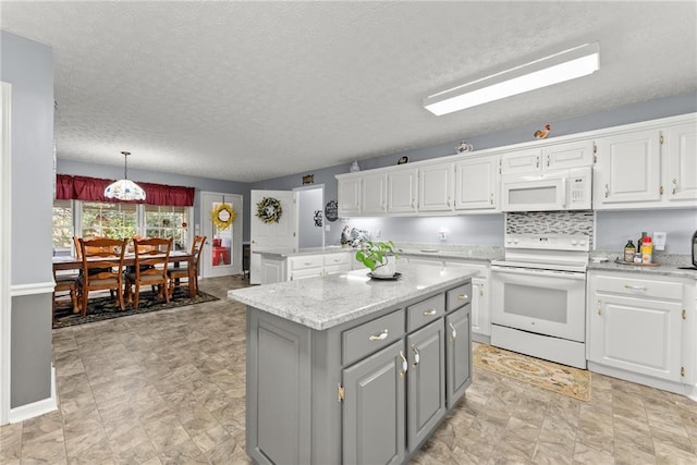 kitchen with a center island, decorative light fixtures, gray cabinets, white cabinetry, and white appliances