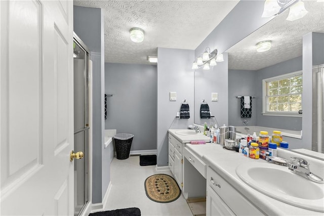 full bath with a shower with shower door, vanity, a textured ceiling, and a bath