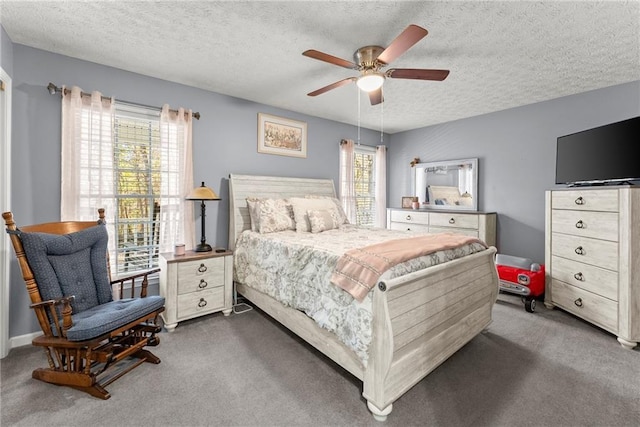 bedroom featuring a textured ceiling, ceiling fan, and carpet flooring