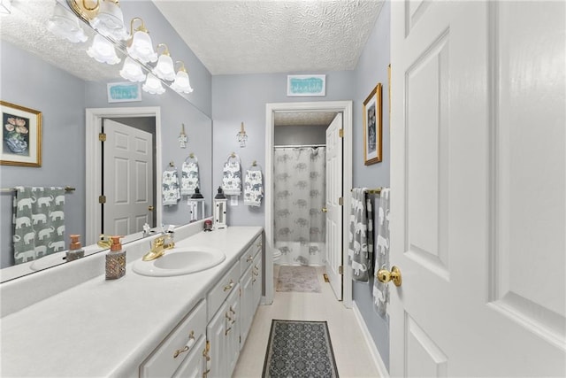 bathroom with toilet, a shower with shower curtain, a textured ceiling, and vanity