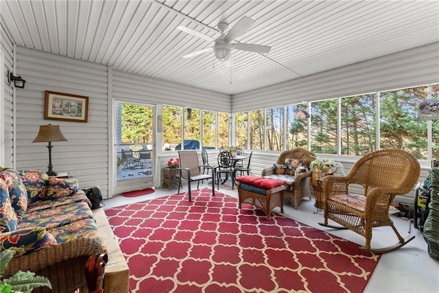 sunroom featuring ceiling fan