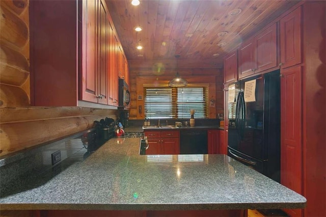 kitchen featuring pendant lighting, sink, black appliances, and kitchen peninsula