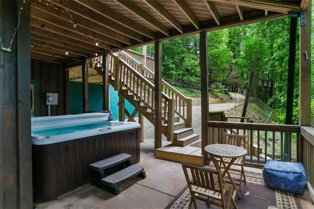 exterior space featuring a hot tub and a patio area